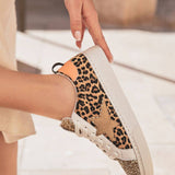 BASKETS LÉOPARD FEMME A PAILLETTES DORÉES - Casualmode.fr